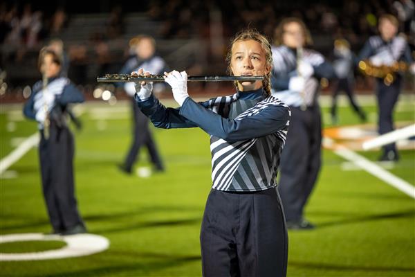 Summit High band members march